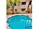 Community pool offers a refreshing escape, set within a well-maintained building and green surroundings at 2605 S Durango Dr # 204, Las Vegas, NV 89117