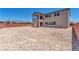 Large backyard with new landscaping and a two-story home at 7151 Serene Creek St, Las Vegas, NV 89131