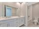 Double vanity bathroom with a shower and toilet at 7151 Serene Creek St, Las Vegas, NV 89131
