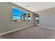 Bedroom with large windows and views at 7151 Serene Creek St, Las Vegas, NV 89131