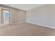 Large bedroom with carpet and access to a hallway at 7151 Serene Creek St, Las Vegas, NV 89131
