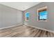 Bedroom featuring wood-look flooring and natural light at 7151 Serene Creek St, Las Vegas, NV 89131