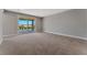 Bedroom with sliding glass door to balcony at 7151 Serene Creek St, Las Vegas, NV 89131