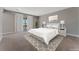 Main bedroom with private balcony access and plush carpet at 7151 Serene Creek St, Las Vegas, NV 89131