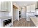 Modern kitchen with double oven and white shaker cabinets at 7151 Serene Creek St, Las Vegas, NV 89131