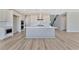 Modern kitchen with a large island and stainless steel appliances at 7151 Serene Creek St, Las Vegas, NV 89131