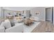 Open living room with ample natural light and a view to the kitchen at 7151 Serene Creek St, Las Vegas, NV 89131