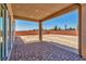 Covered patio with brick pavers, overlooking the backyard at 7151 Serene Creek St, Las Vegas, NV 89131
