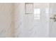 Clean shower with marble-style tile at 7151 Serene Creek St, Las Vegas, NV 89131