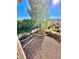 Upper-level balcony showcases spacious backyard and lush landscaping, and a view from above at 2089 Avalon Dr, Laughlin, NV 89029
