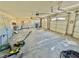 Spacious two-car garage with white doors, concrete floor and ample storage space at 2089 Avalon Dr, Laughlin, NV 89029