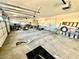 Spacious two-car garage with concrete floor, storage and work space at 2089 Avalon Dr, Laughlin, NV 89029