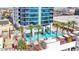 Luxury high rise building with a resort-style pool and palm trees at 4381 W Flamingo Rd # 1903, Las Vegas, NV 89103