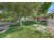 Lawn and trees in fenced backyard at 6990 W Richmar Ave, Las Vegas, NV 89178