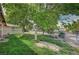 Well maintained backyard area with mature trees overlooking the in-ground pool at 6990 W Richmar Ave, Las Vegas, NV 89178