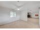 Cozy living room with a ceiling fan and view of the exterior at 6990 W Richmar Ave, Las Vegas, NV 89178