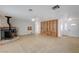 Bright living room featuring a unique fireplace, built-in shelves, and a light-filled ambiance at 6990 W Richmar Ave, Las Vegas, NV 89178