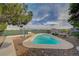 Clear blue pool with a lounge chairs, and distant views at 6990 W Richmar Ave, Las Vegas, NV 89178