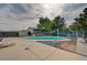 Inviting in-ground swimming pool with patio area, surrounded by mature landscaping and a fenced yard at 6990 W Richmar Ave, Las Vegas, NV 89178