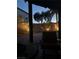 Cozy backyard with privacy fence, pavers, and relaxing seating area with outdoor lighting at 6007 Turtle River Ave, Las Vegas, NV 89156