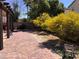 Backyard featuring trees, a brick patio, and plenty of room to roam at 6007 Turtle River Ave, Las Vegas, NV 89156