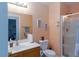Bathroom featuring a single vanity, toilet, and walk-in shower with glass door at 6007 Turtle River Ave, Las Vegas, NV 89156