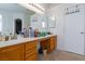 Bathroom with double vanity, a large mirror, and ample countertop space at 6007 Turtle River Ave, Las Vegas, NV 89156