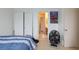 Bedroom with sliding door closet, bathroom access, and fan on the floor at 6007 Turtle River Ave, Las Vegas, NV 89156
