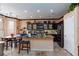 Modern kitchen featuring stainless steel appliances and granite countertops at 6007 Turtle River Ave, Las Vegas, NV 89156