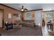 Cozy living room featuring comfortable seating and access to the backyard at 6007 Turtle River Ave, Las Vegas, NV 89156