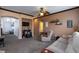 Comfortable living room featuring neutral decor and access to other rooms at 6007 Turtle River Ave, Las Vegas, NV 89156