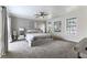 Spacious primary bedroom with ample natural light and modern ceiling fan at 2000 S Monte Cristo Way, Las Vegas, NV 89117