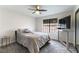 Cozy bedroom with a standing desk and plenty of natural light at 2000 S Monte Cristo Way, Las Vegas, NV 89117