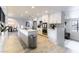 Modern kitchen with white cabinets, island, and stainless steel appliances at 2000 S Monte Cristo Way, Las Vegas, NV 89117