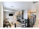 Living room with a stone fireplace and a view of the kitchen at 2000 S Monte Cristo Way, Las Vegas, NV 89117