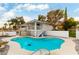 Inviting kidney-shaped pool with surrounding patio and lounge chairs at 2000 S Monte Cristo Way, Las Vegas, NV 89117