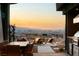 Outdoor patio featuring a fire pit, dining table, built-in grill and picturesque city views at 4 Horseshoe Rock Ct, Henderson, NV 89012