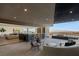 Expansive outdoor patio space including an outdoor kitchen, lounge seating and city views at 4 Horseshoe Rock Ct, Henderson, NV 89012