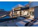 Luxurious home with an infinity pool, lounge chairs, and spa, perfect for relaxation and entertainment at 4 Horseshoe Rock Ct, Henderson, NV 89012