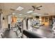 Well-equipped gym with modern exercise machines, mirrors, and ceiling fans for a comfortable workout experience at 437 Via Ventana Dr, Mesquite, NV 89027