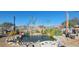 Serene backyard oasis featuring a charming pond with aquatic plants and landscaping at 351 Bunarch Rd, Pahrump, NV 89060