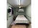 Small bedroom with a bed and ceiling fan at 351 Bunarch Rd, Pahrump, NV 89060