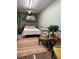 Bedroom with seating area and wood floors at 351 Bunarch Rd, Pahrump, NV 89060