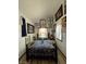 Quaint bedroom with a unique bedspread and eclectic wall art at 351 Bunarch Rd, Pahrump, NV 89060