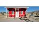 Red cabin with picnic table and grill at 351 Bunarch Rd, Pahrump, NV 89060