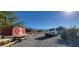 Red barn, picnic table, and truck in a sunny yard at 351 Bunarch Rd, Pahrump, NV 89060