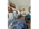 Small home interior with bed, couch, and eclectic decor at 351 Bunarch Rd, Pahrump, NV 89060