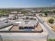This aerial shows the home's modern design, desert landscaping, pool, and neighborhood at 7062 Maverick St, Las Vegas, NV 89131