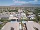 This aerial shows the neighborhood and surrounding desert area with its various home styles and pools at 7062 Maverick St, Las Vegas, NV 89131