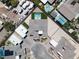 Aerial view of a well-maintained desert home with adjacent pools surrounded by a neighborhood and desert scenery at 7062 Maverick St, Las Vegas, NV 89131